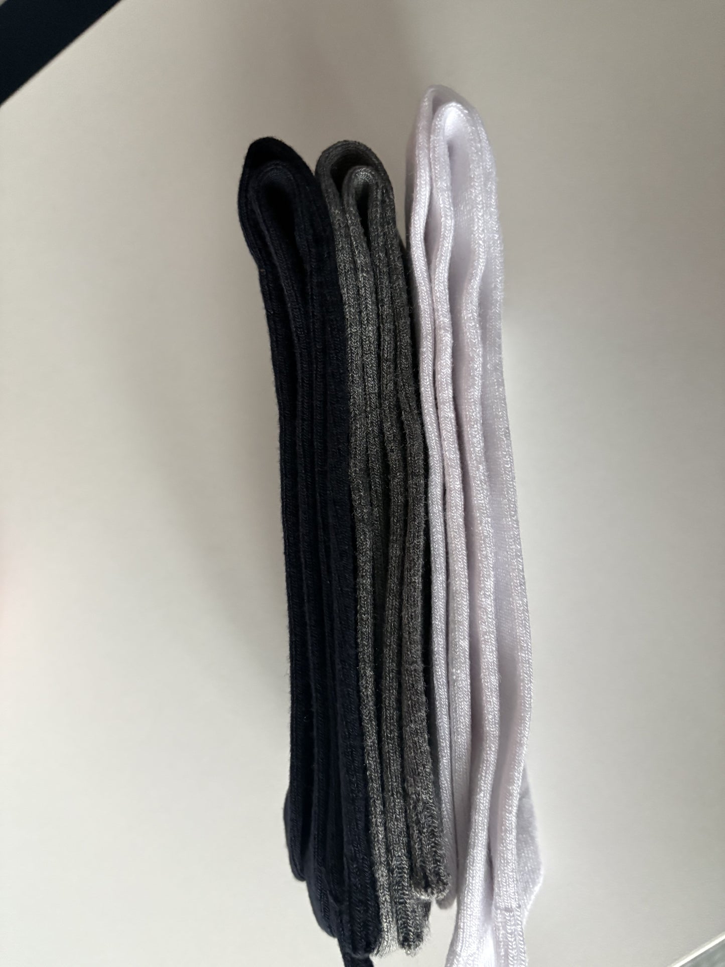 Pair of black and gray socks on a white background