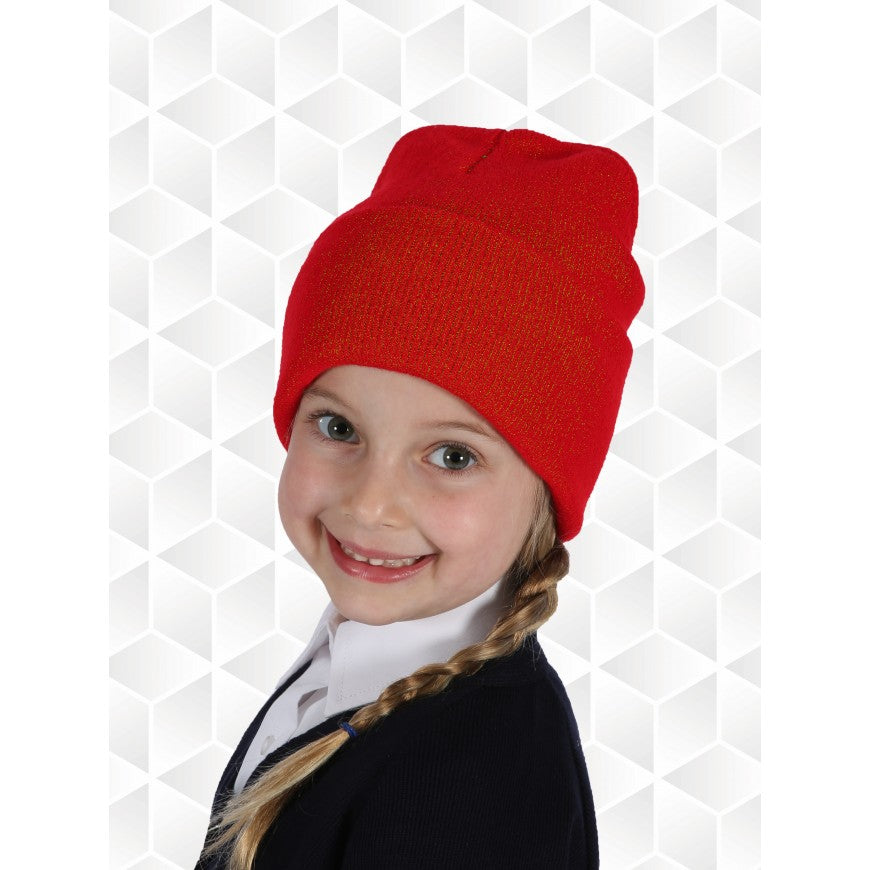 Child wearing a red beanie against a geometric patterned background