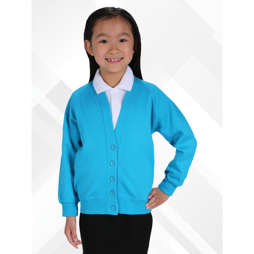 Young girl wearing a blue cardigan over a white shirt on a white background